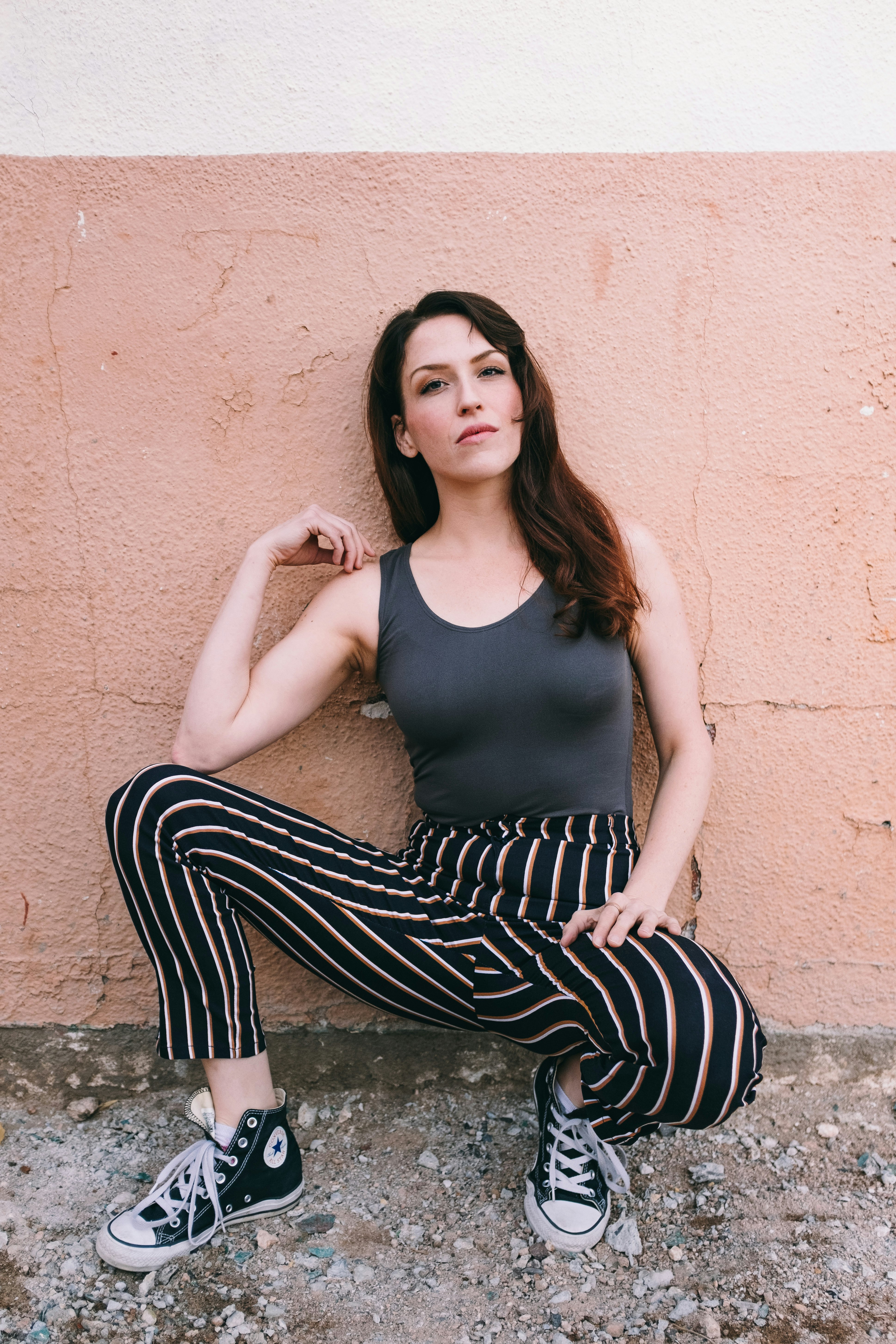 woman leaning on wall